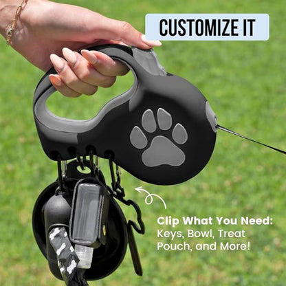 Award-Winning Retractable Dog Leash for Small and Medium Dogs (Max 55 lbs), Clip & Go System with Reflective Tape and Ergonomic Handle, Includes Clips, Poop Bag Holder and Dispenser, Black