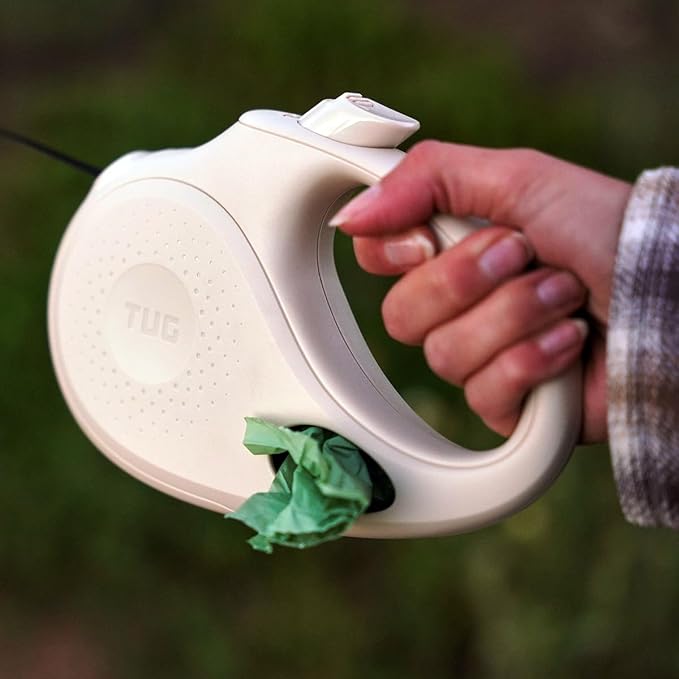TUG Oval 360° Tangle-Free Retractable Dog Leash with Integrated Waste Bag Dispenser (Medium, Cream)