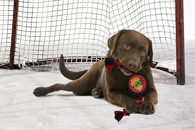 Pets First Dog Rubber Toy Tough Rubber with Heavy-Duty Dog Rope Tug Toy. NHL Chicago Blackhawks Puck Toy for Dogs & Cats. Play Hockey with Your Pet with This Licensed Dog Puck Rubber Cool Toy!